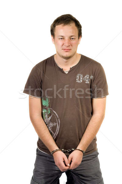 The guy chained in handcuffs. Isolated  Stock photo © acidgrey