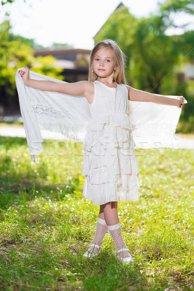 Piękna dziewczynka biała sukienka stwarzające odkryty Zdjęcia stock © acidgrey