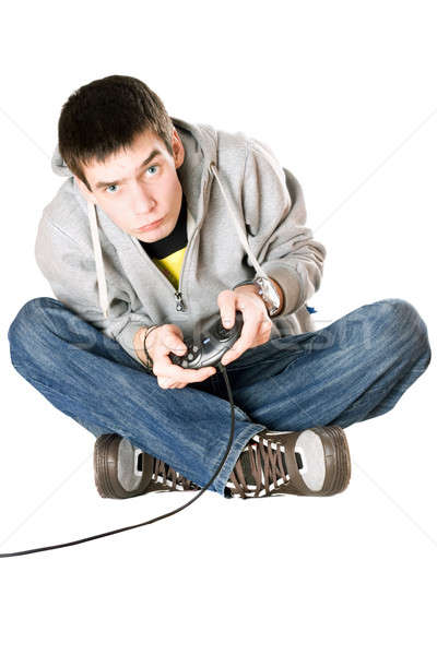Jonge man bedieningshendel spel troosten jeans video Stockfoto © acidgrey