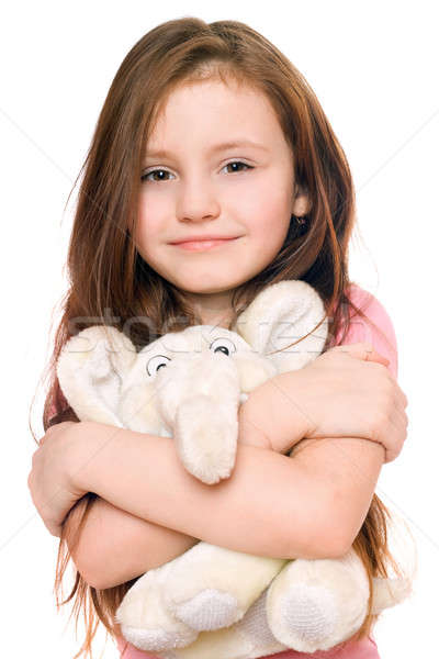 Portrait of smiling little girl with a teddy elephant Stock photo © acidgrey