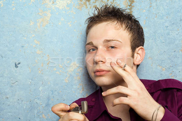 Portre genç sigara çakmak yüz adam Stok fotoğraf © acidgrey
