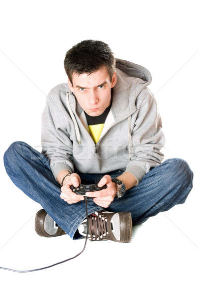 Guy with a joystick for game console. Isolated Stock photo © acidgrey