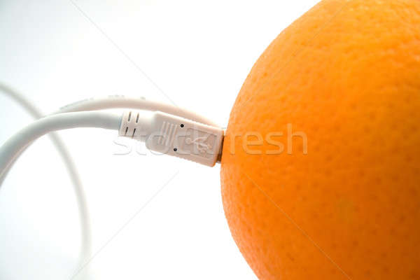 The orange connected through usb cable 2 Stock photo © acidgrey