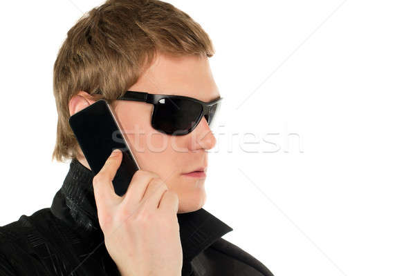 Young man with a phone Stock photo © acidgrey