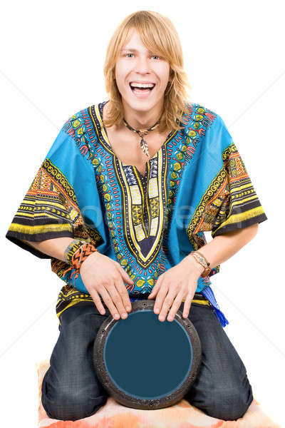 Stock photo: The young man plays a drum over white