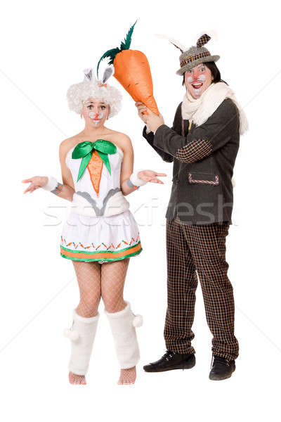 Stock photo: Funny couple with carrot