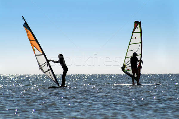 Silhouette of a two windsurfers Stock photo © acidgrey