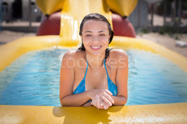 Csinos derűs nő pózol citromsárga úszómedence Stock fotó © acidgrey