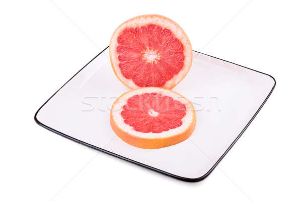 Grapefruit in square plate Stock photo © acidgrey