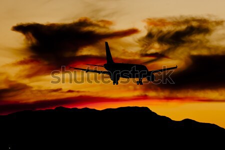 Aircraft Landing At Sunset Stock photo © actionsports