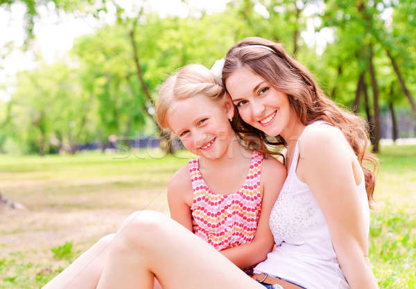 mother and daughter sitting together on the grass Stock photo © adam121