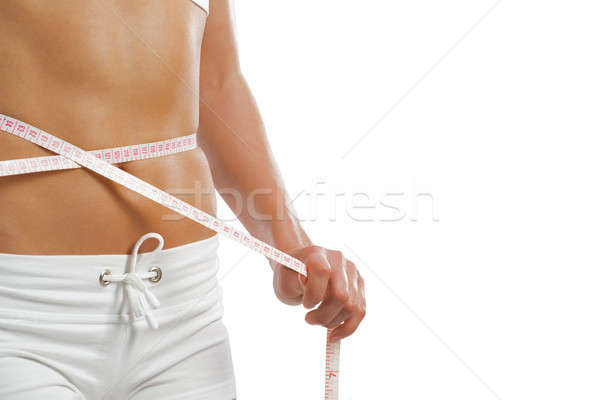 young athletic woman measuring waist Stock photo © adam121