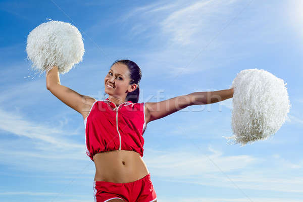 Young cheerleader in red costume with pampon Stock photo © adam121