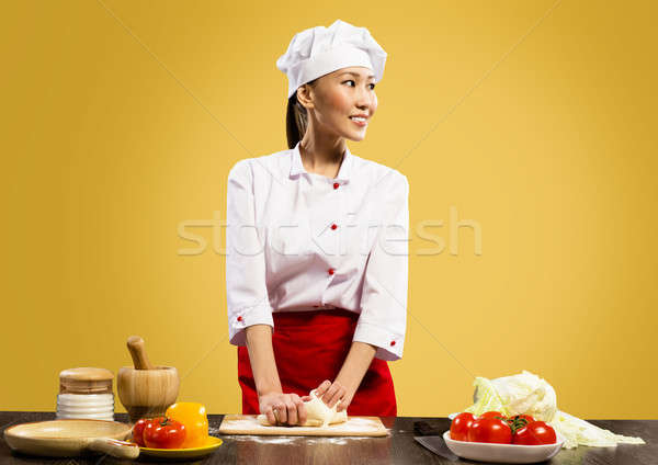 Asian female chef cooking pizza dough Stock photo © adam121