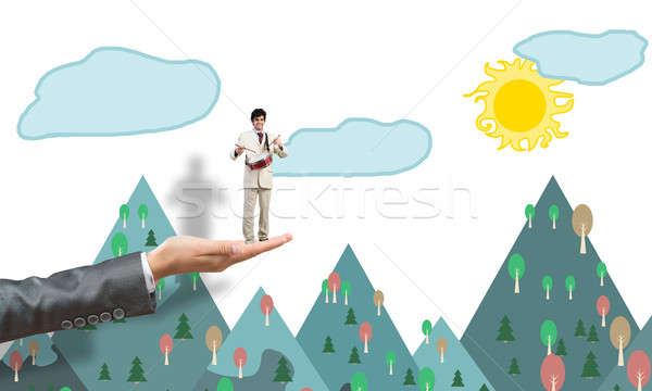 Palm supporting businessman Stock photo © adam121