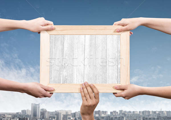 Stock photo: Hands holding frame