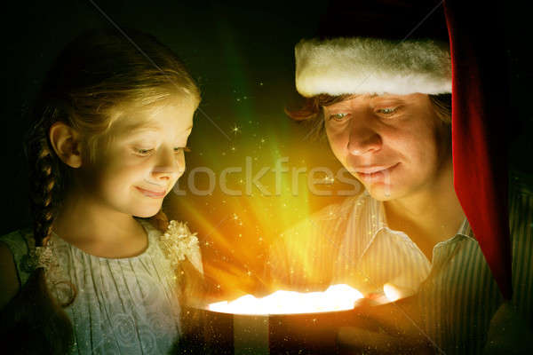 father and daughter opened a box with a gift Stock photo © adam121