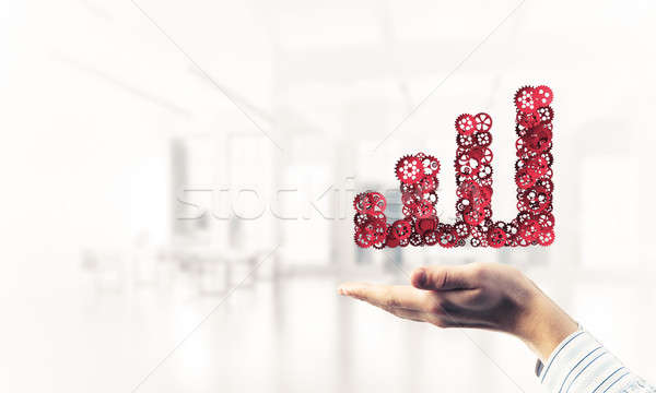 Progressing graph presented in male palms as symbol of success a Stock photo © adam121
