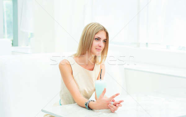 Stock photo: portrait of a beautiful woman in the cafe