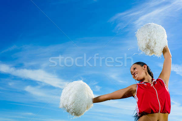 Young cheerleader in red costume with pampon Stock photo © adam121