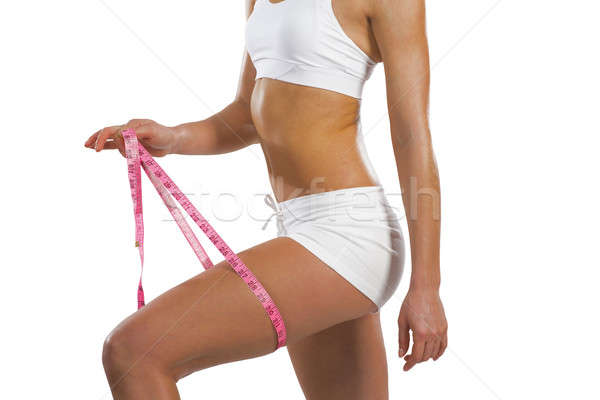 athletic woman measuring thigh Stock photo © adam121