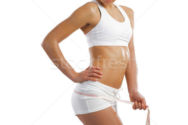 young athletic woman measuring waist Stock photo © adam121