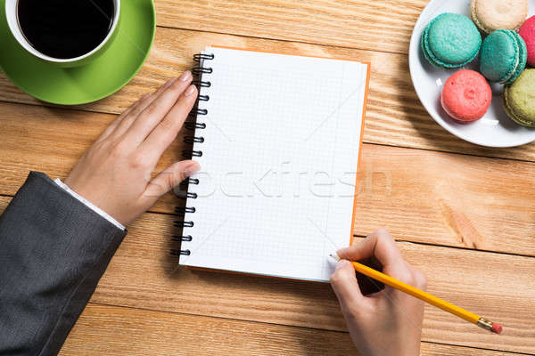 Stock photo: Businesswoman making some notes