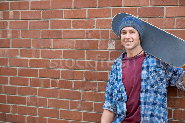 Handsome guy with skateboard Stock photo © adam121