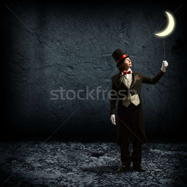 magician keeps the moon on a string Stock photo © adam121