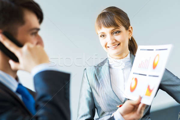 two business partners discussing reports Stock photo © adam121