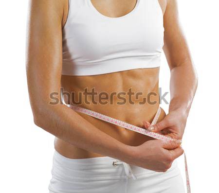 [[stock_photo]]: Jeunes · athlétique · femme · taille · mètre · à · ruban