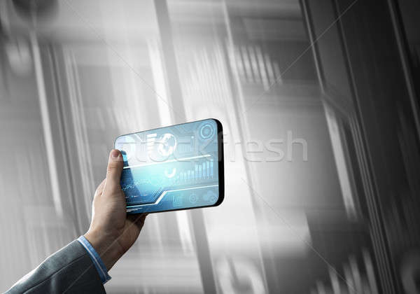 Media technology concept presented by businessman holding tablet Stock photo © adam121