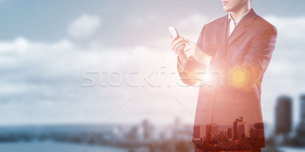 Businessman use mobile phone Stock photo © adam121