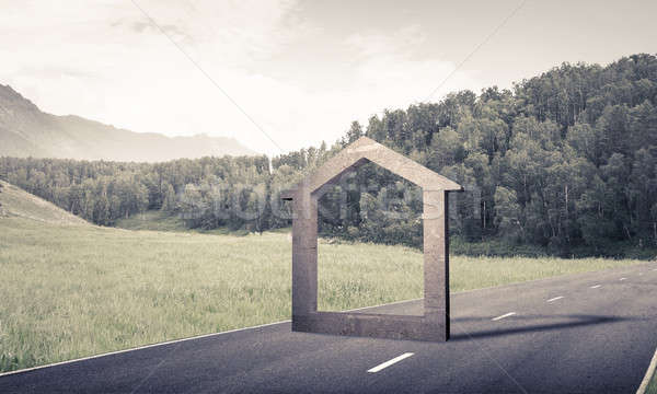 Conceptual background image of concrete home sign on asphalt roa Stock photo © adam121