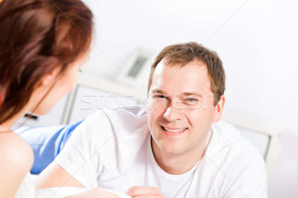 young man lying in bed with his girlfriend Stock photo © adam121