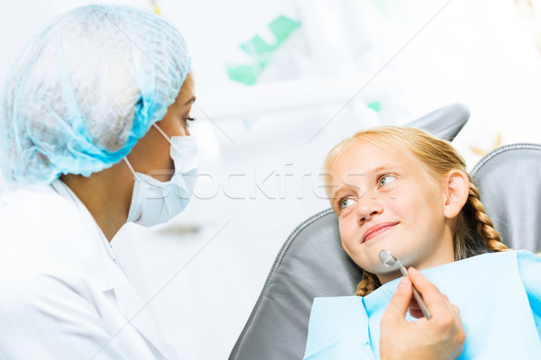 Dentist inspecting patient Stock photo © adam121