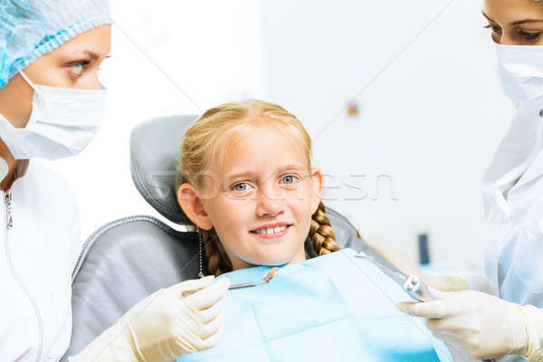 Dentist inspecting patient Stock photo © adam121