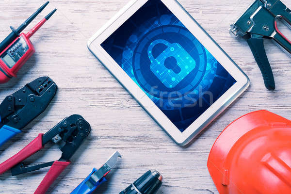 Web security and technology concept with tablet pc on wooden tab Stock photo © adam121