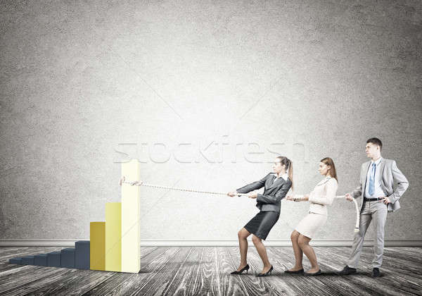 Businessteam working in collaboration pulling graph with rope as Stock photo © adam121