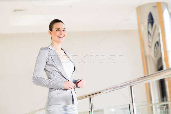 Business woman standing in the lobby of the office Stock photo © adam121