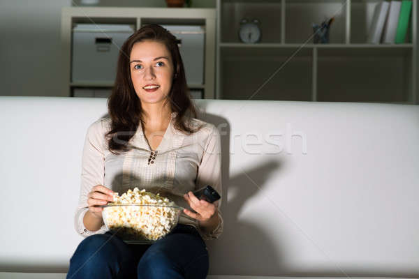 young woman watching TV Stock photo © adam121