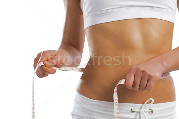 young athletic woman measuring waist Stock photo © adam121