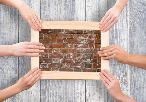 Stock photo: Hands holding frames