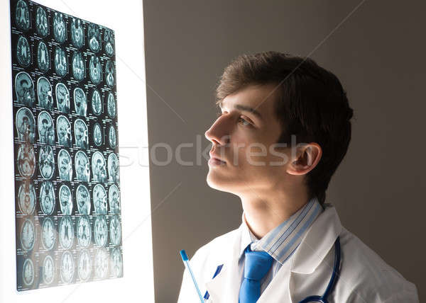 male doctor looking at the x-ray image Stock photo © adam121