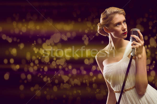 attractive female singer with microphone Stock photo © adam121