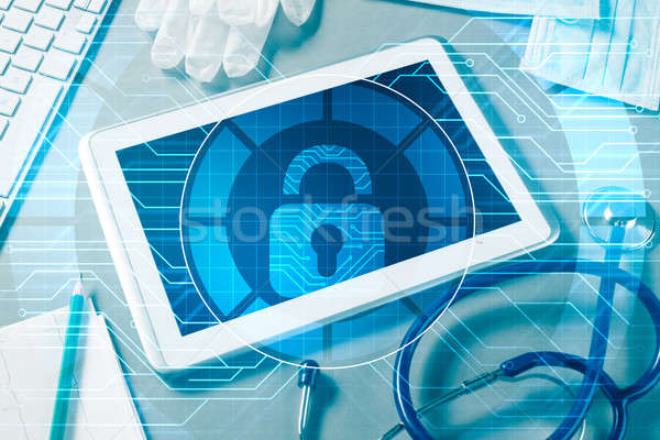 Top view of doctor workplace with tablet pc and medicine tools o Stock photo © adam121