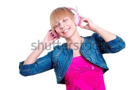 Young attractive woman listing to music Stock photo © adam121