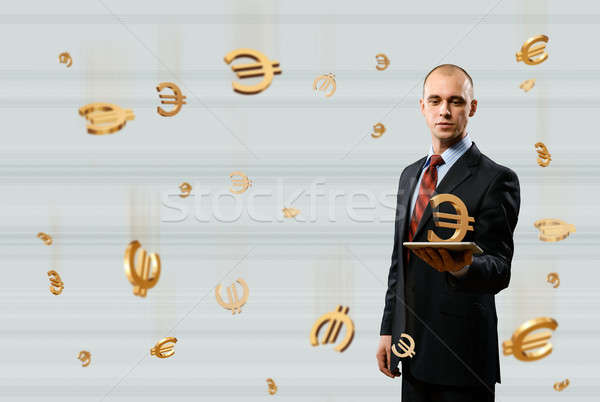 man holding tablet with euro symbol Stock photo © adam121