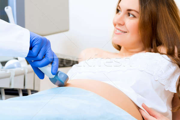 close-up of hands and abdominal ultrasound scanner Stock photo © adam121