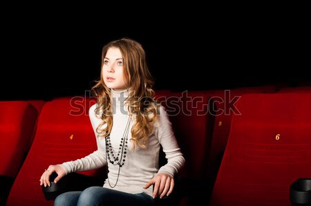 young attractive woman sitting in a cinema Stock photo © adam121